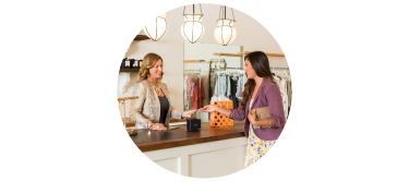 Women checking out in retail store